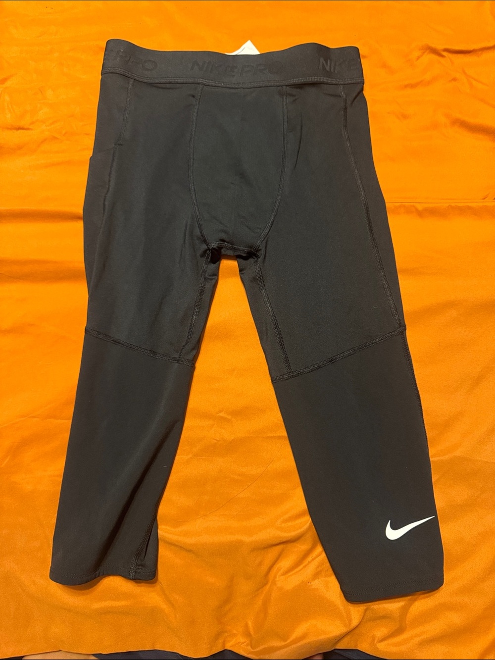Nike Black Cropped Performance Leggings with White Swoosh